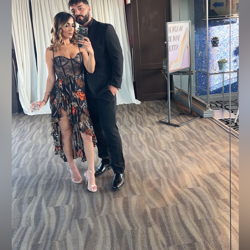 This dress has a slit on the left leg. Never has been worn either